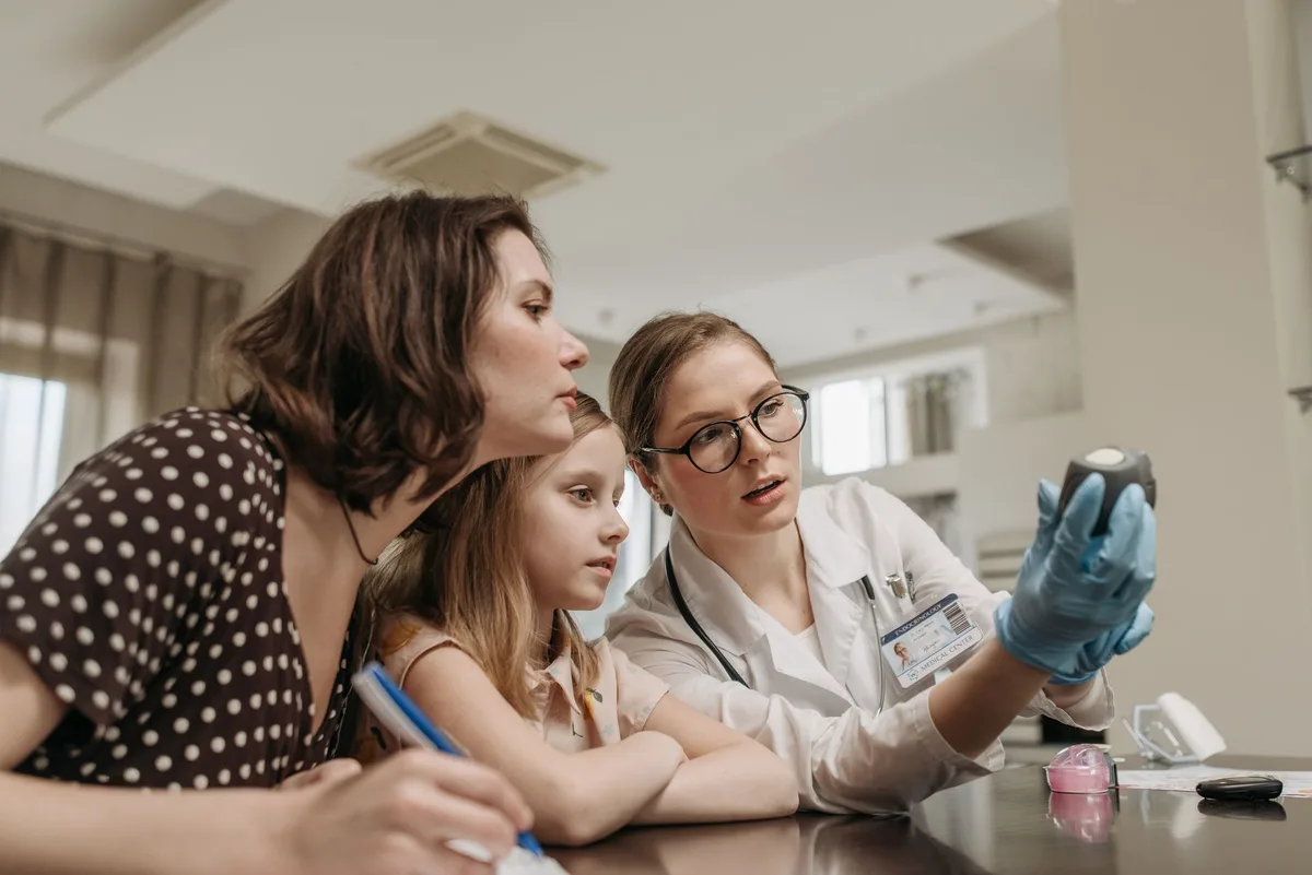 Professional medical care setting with anonymous healthcare worker attending to patient, specialized equipment visible, compassionate care environment, neutral clinical atmosphere
