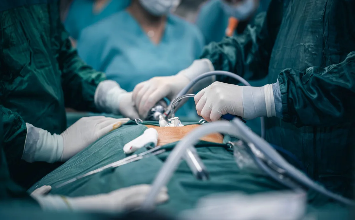 A minimalist medical workspace with surgical instruments and a stethoscope on a desk, soft ambient lighting, suggesting professional excellence and dedication