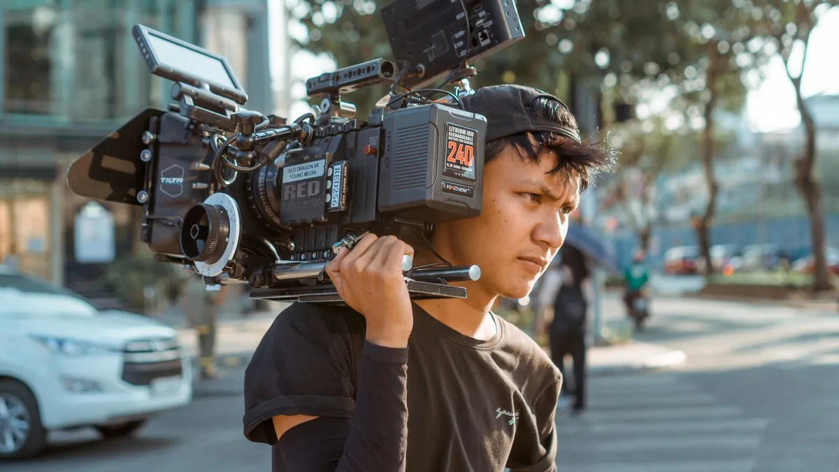 A dimly lit scene with Asian film posters and movie stills featuring action sequences and dramatic moments, evoking the diverse genres of martial arts, horror, and romance from across Asia.
