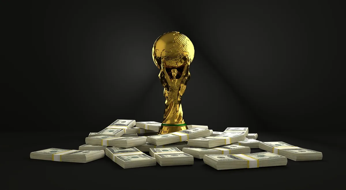 A spotlight illuminating an empty stage with a single award statue in sharp focus, the theater seats blurred in darkness, a single leopard-shaped trophy gleaming under warm light, anticipation and prestige in the frame