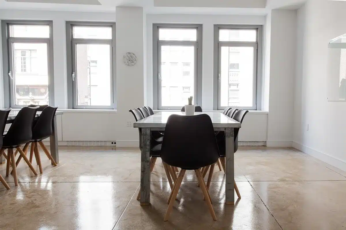A child's bedroom with toys scattered, a window with soft light filtering through, empty and quiet, conveying loss and the impact of family changes on younger family members