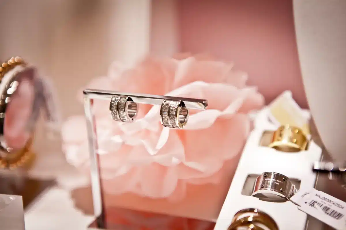 empty jewelry display on a quiet shop floor, a single box open on the counter, no logos or people