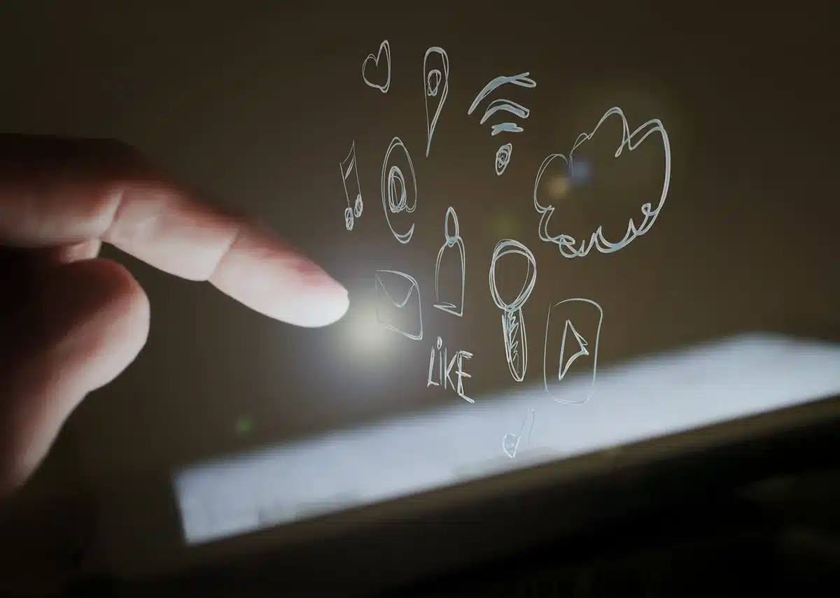 anonymous reaction silhouette near a smartphone showing social media comments, hands raised in blurred motion
