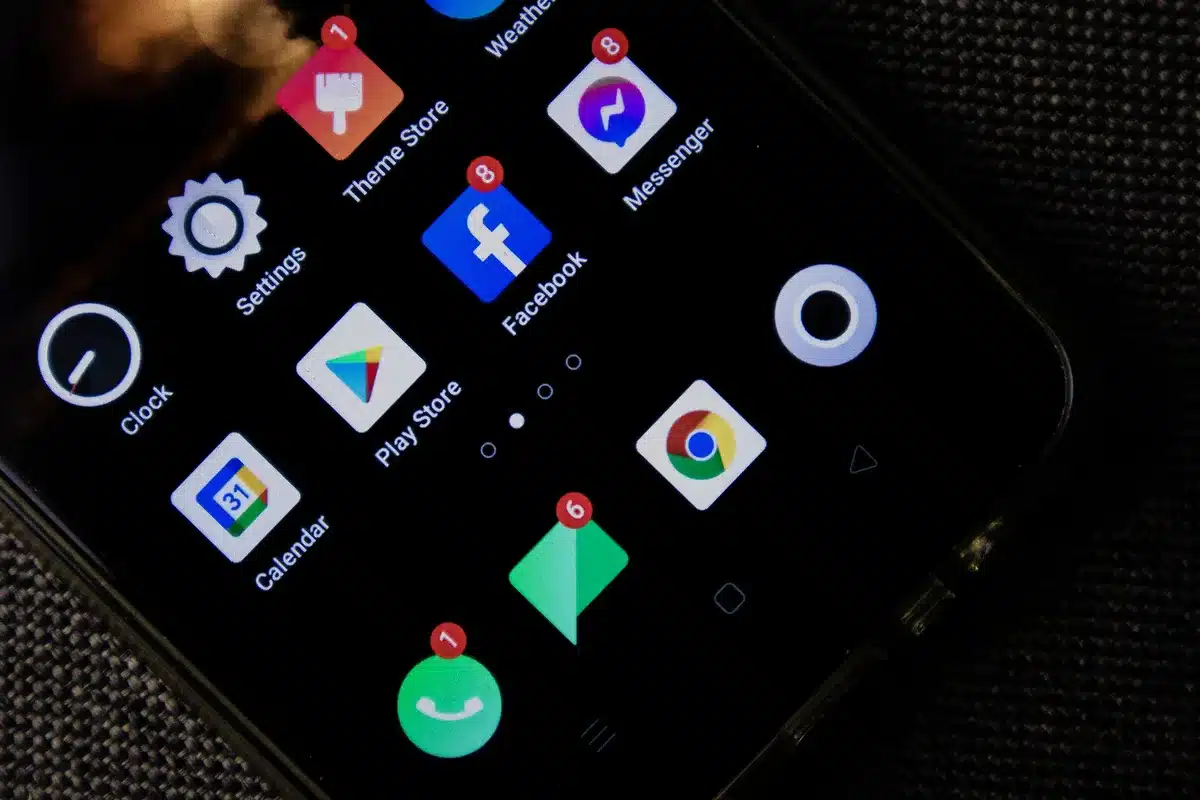 empty smartphone on a bedside table with unread notification icons on screen